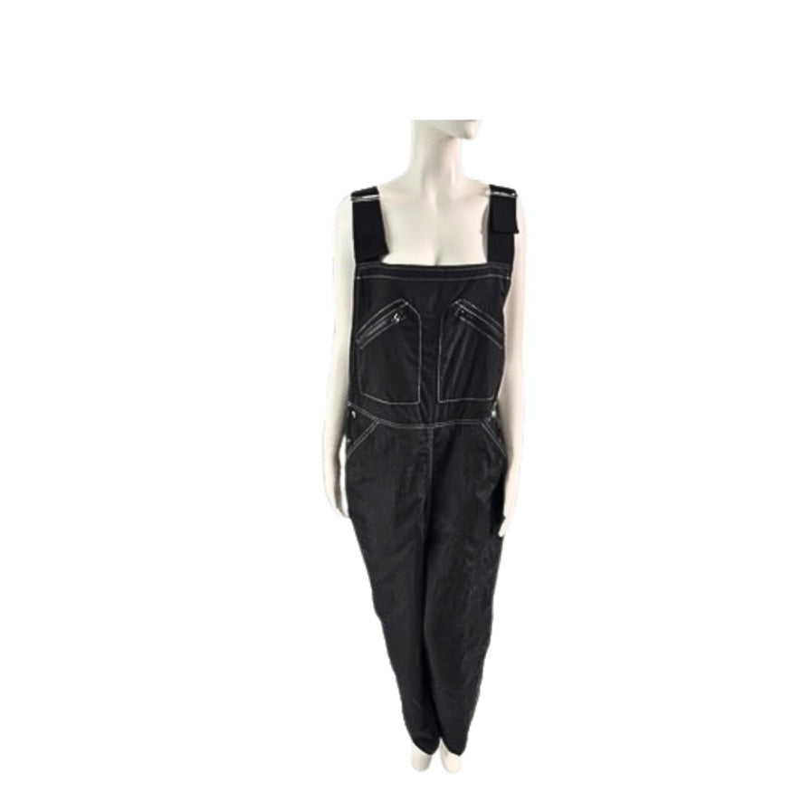 Black overalls on a mannequin against a white background