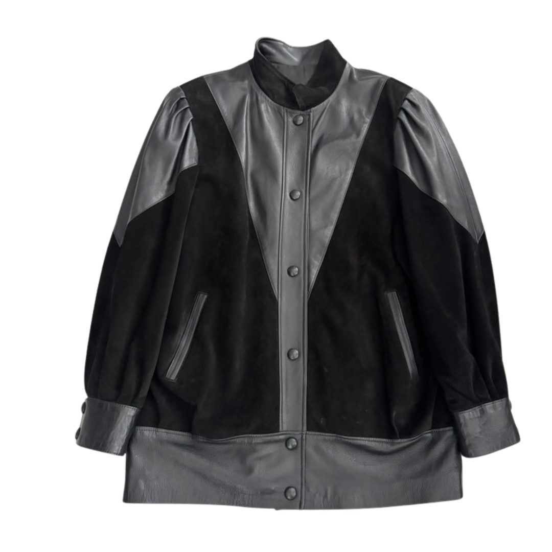 Black leather and suede jacket with button details on a white background