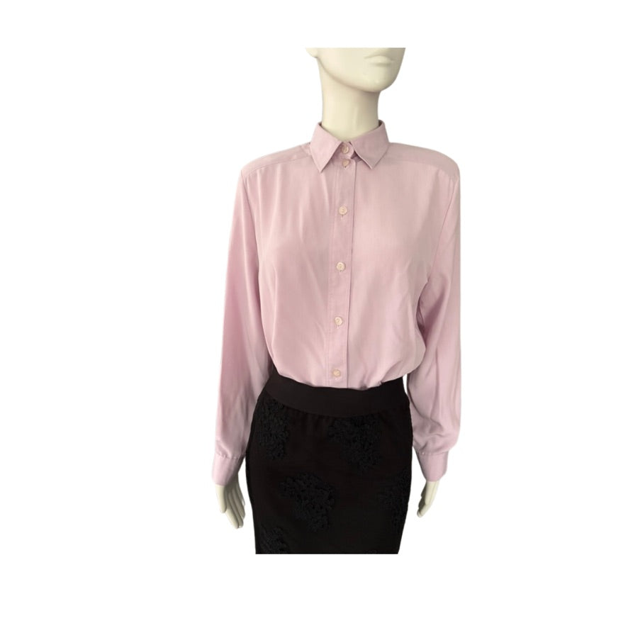 Pink shirt on a mannequin against a white background