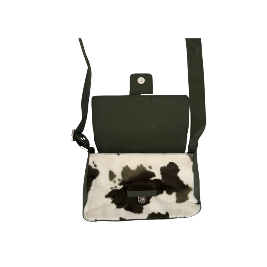 Black and white cowhide leather crossbody bag on a white background