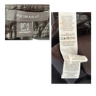 Close-up of Primark label and care instructions tag on clothing.