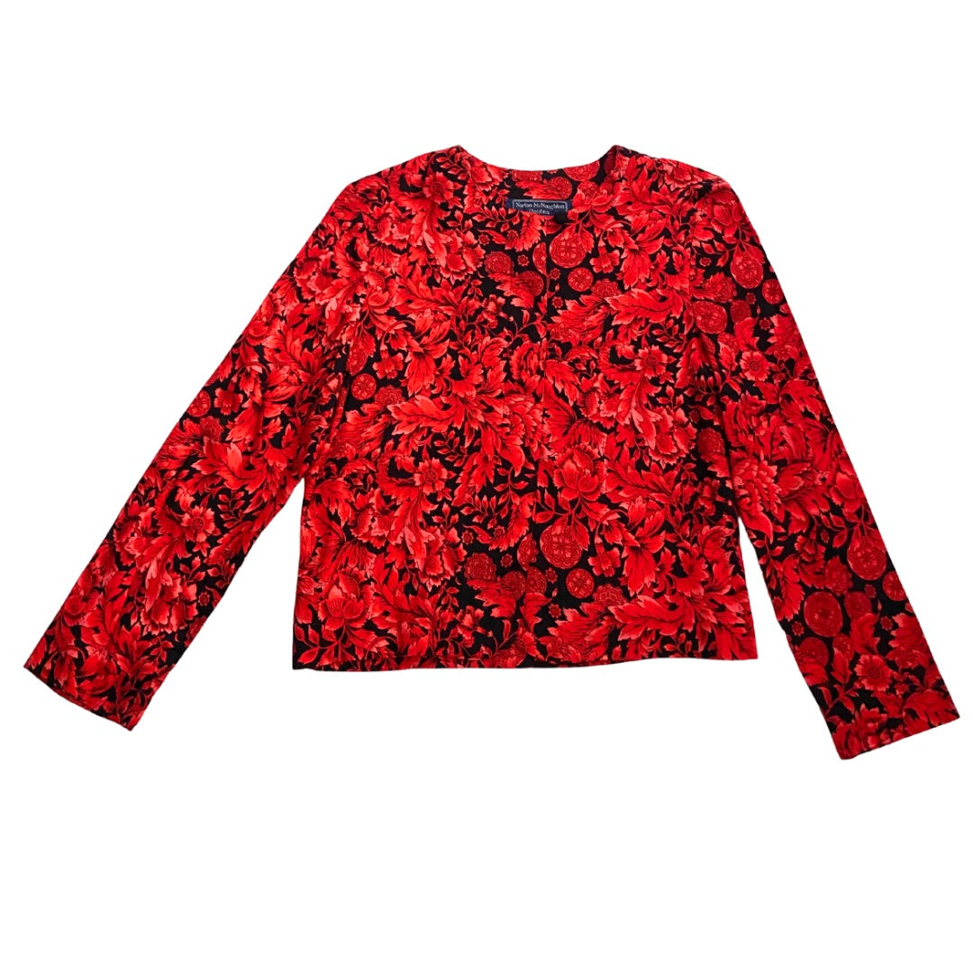 A vintage red and black floral pattern button front blouse with long sleeves.