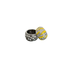 Silver crystal and yellow accent rings on a white background