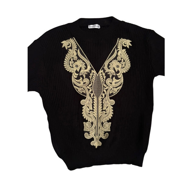 Black sweater with gold embroidery on a white background
