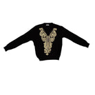 Black sweater with gold embroidery on a white background