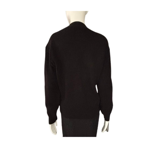 Black sweater on a mannequin against a white background