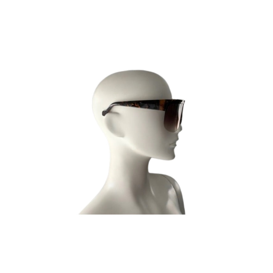 Sunglasses on a mannequin head against a white background