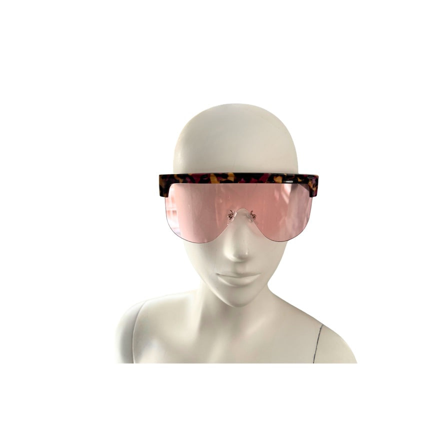 Mannequin head wearing a pair of sunglasses with a white background