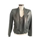 Green  leather jacket on a mannequin against a white background