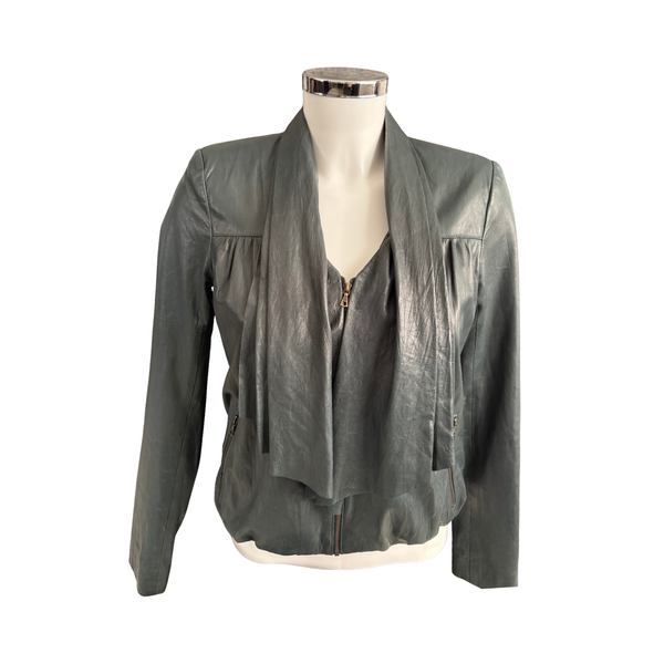 Green  leather jacket on a mannequin against a white background