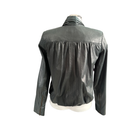 Green leather jacket on a mannequin against a white background