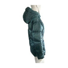 Green puffer coat on a mannequin against a white background