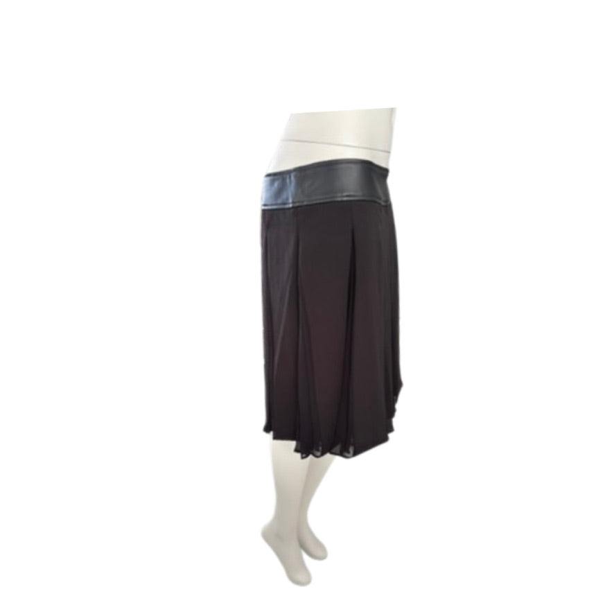 Black skirt with a white band on a mannequin against a white background