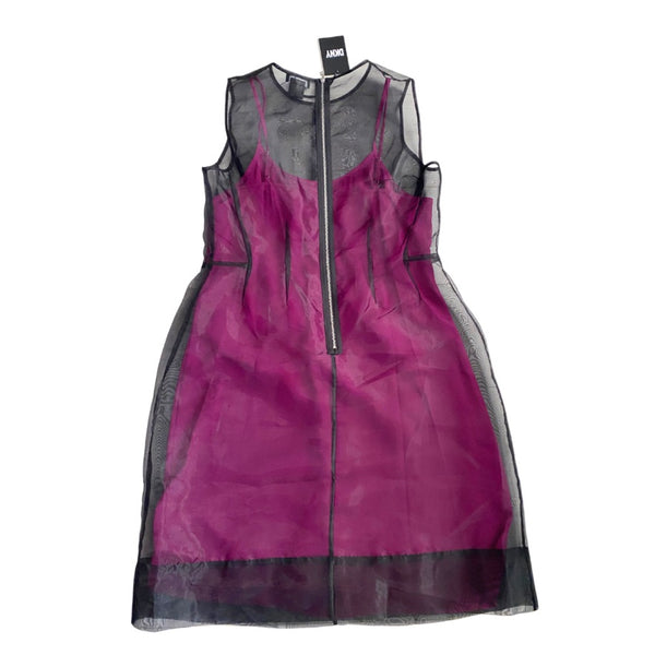 Pink dress with sheer panels on a white background