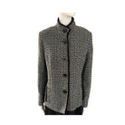 Black and white checkered jacket on a mannequin against a white background