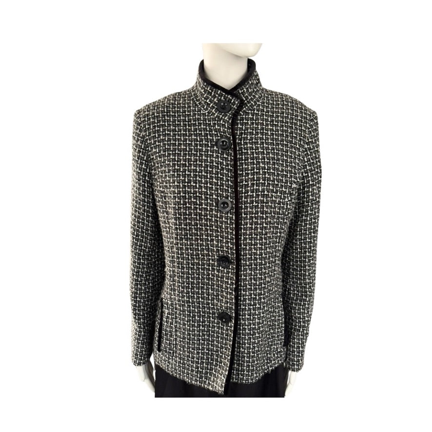 Black and white checkered jacket on a mannequin against a white background