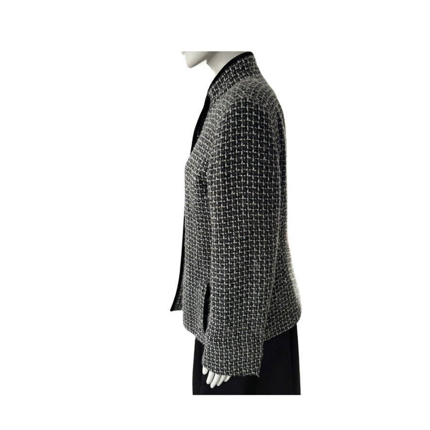 Mannequin wearing a textured gray coat on a white background