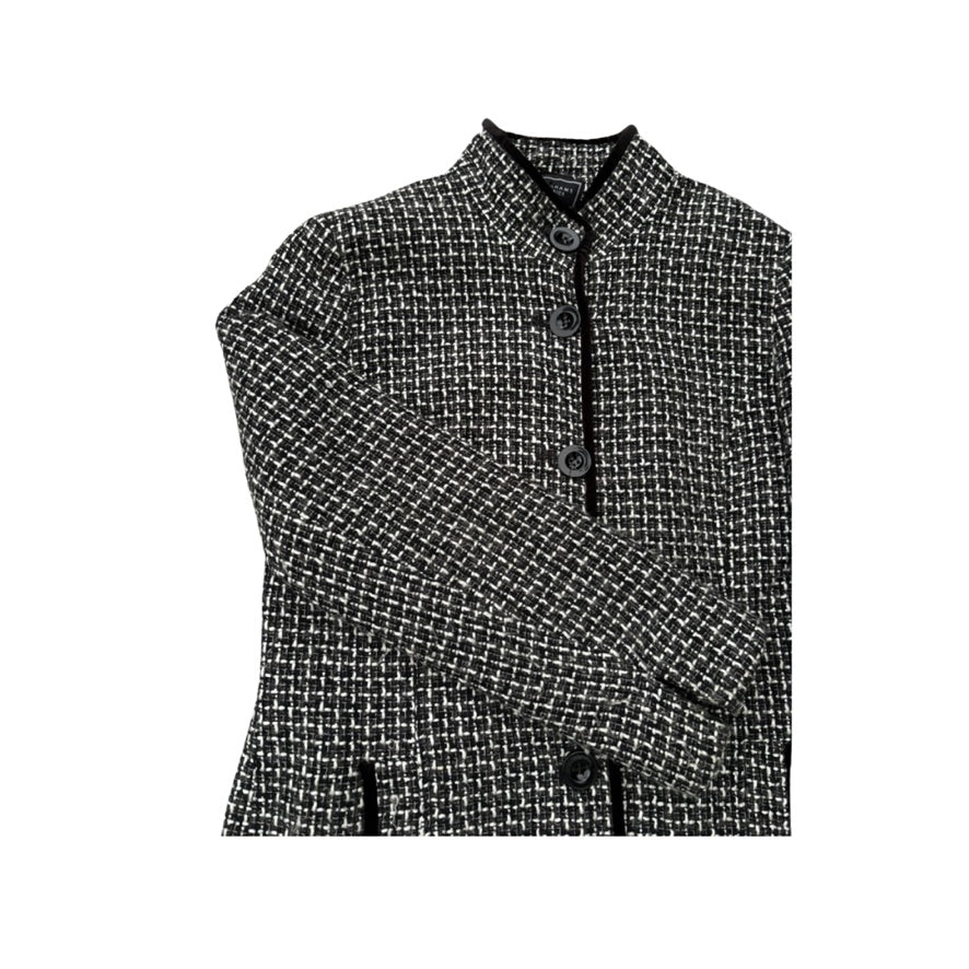 Black and white checkered shirt with buttons on a white background