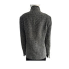 Black and white checkered jacket on a mannequin against a white background