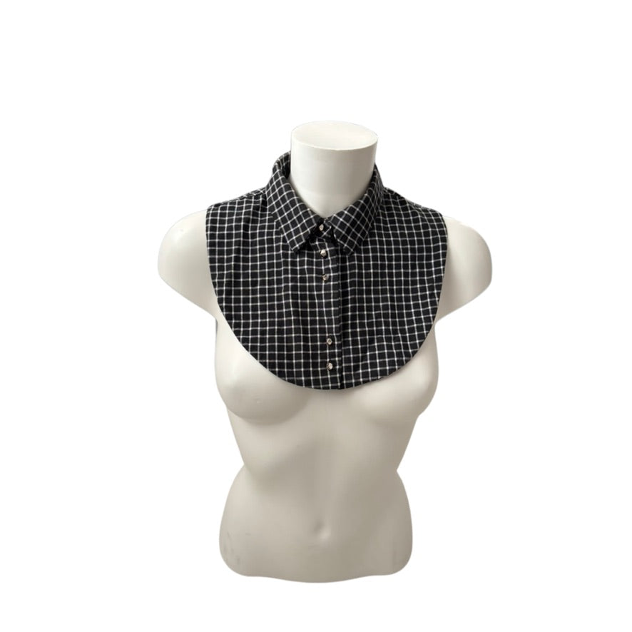 Black and white checkered collar on a mannequin bust against a white background