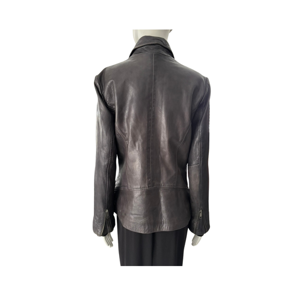 Dark leather jacket on a mannequin against a white background