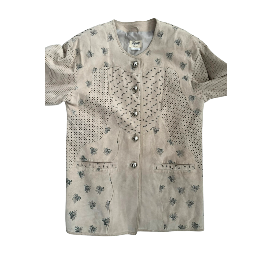 Beige shirt with floral patterns and buttons on a white background