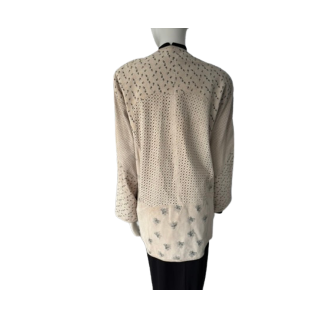 Mannequin wearing a beige cardigan with a subtle pattern on a white background