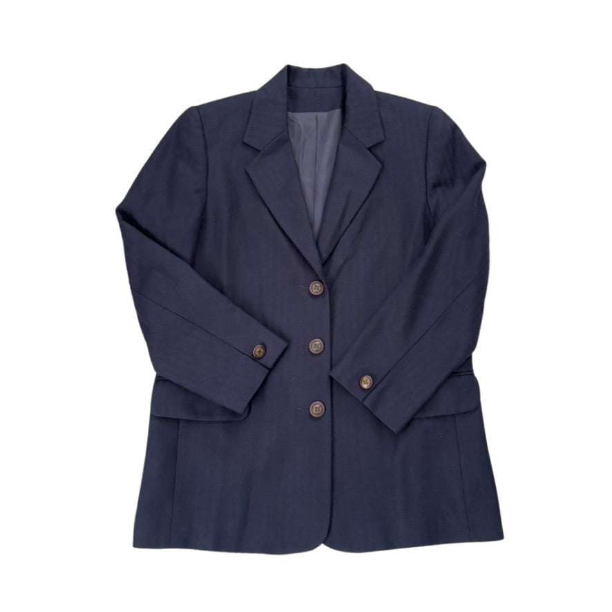 Navy blue blazer with button details on a white background