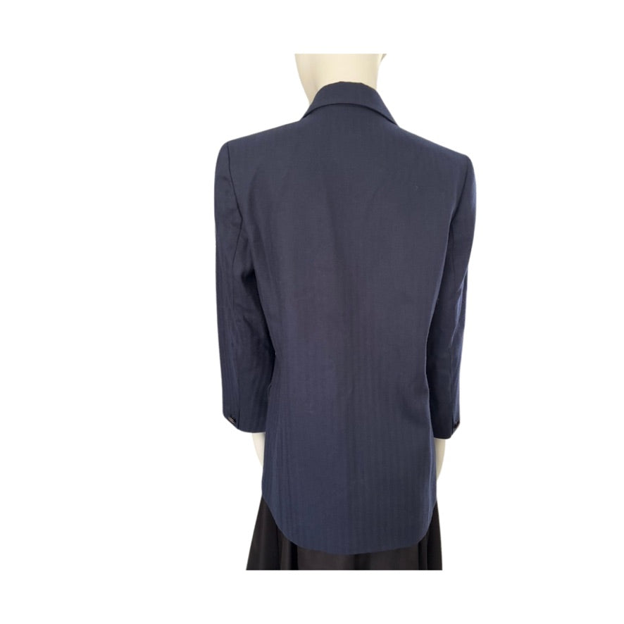 Navy blue blazer on a mannequin against a white background
