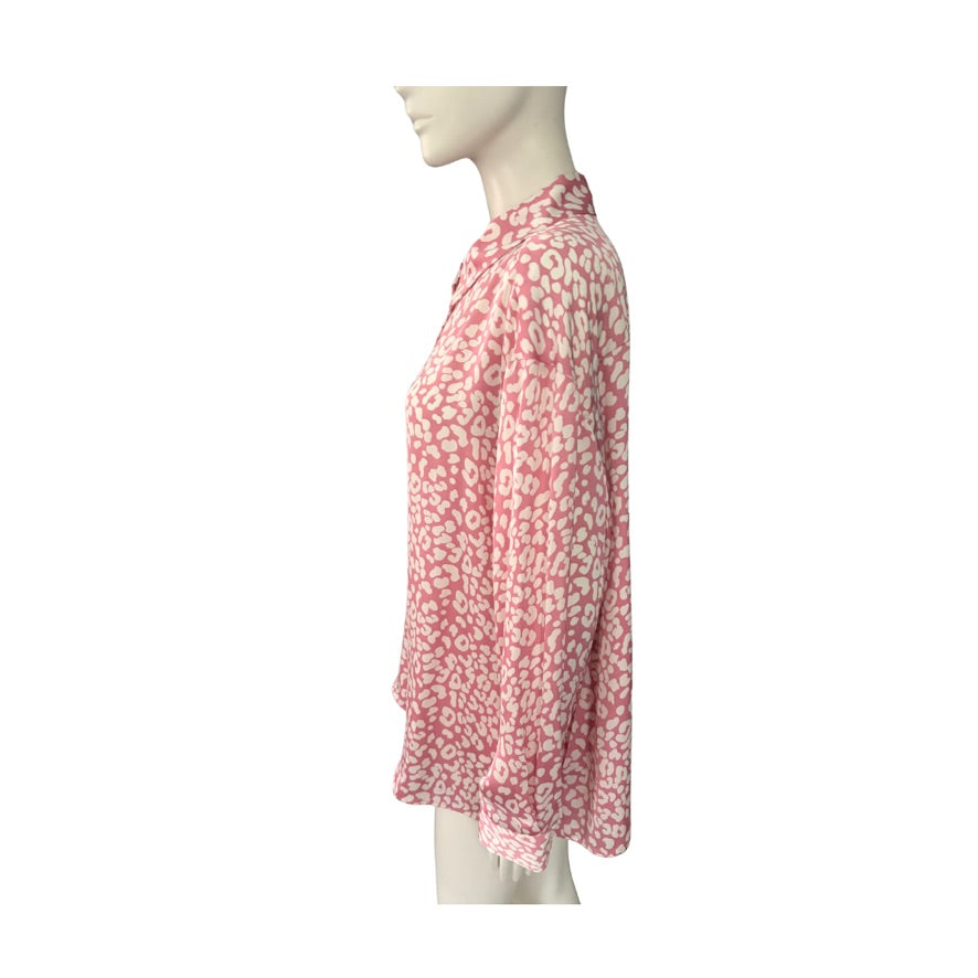 Mannequin wearing a pink floral dress on a white background