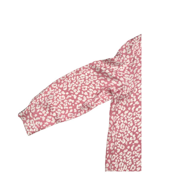 Pink headband with white floral pattern on a white background