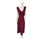Maroon dress on a mannequin against a white background