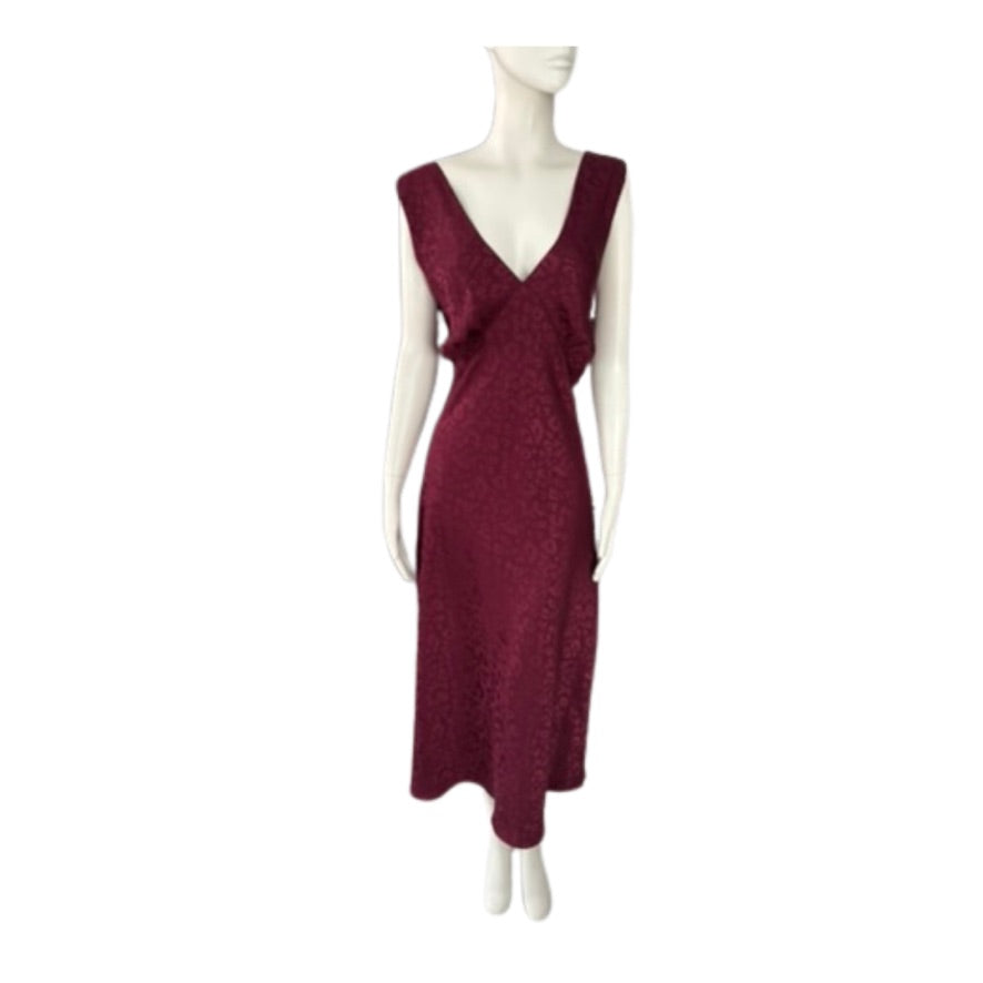 Maroon dress on a mannequin against a white background