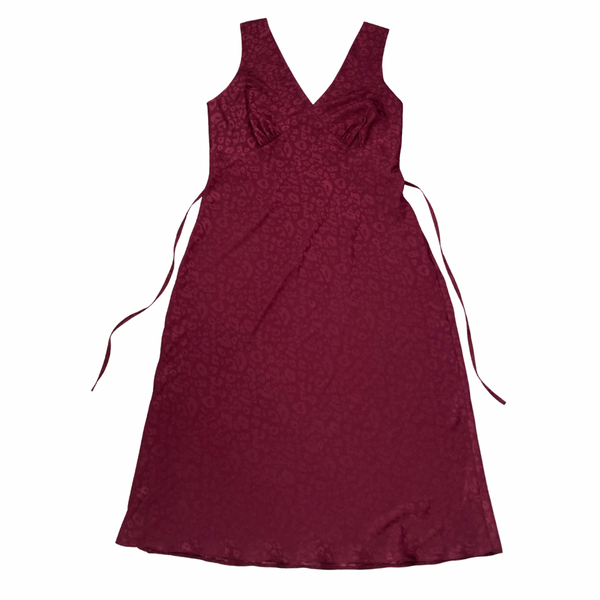 Maroon dress with thin straps on a white background
