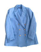 Blue blazer with gold buttons on a white background