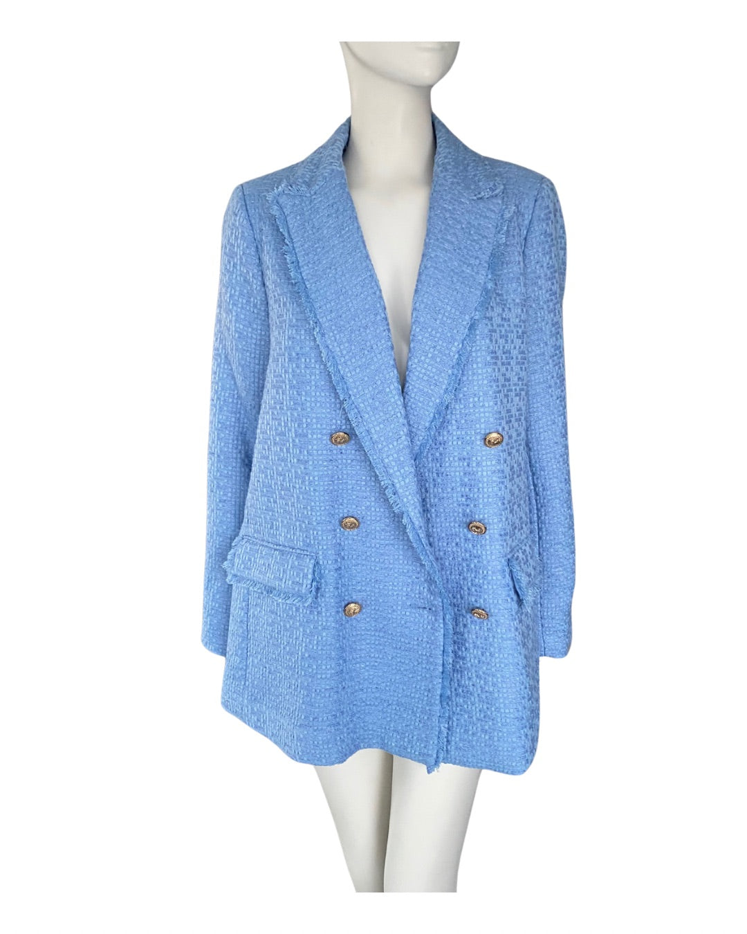 Blue blazer on a mannequin against a white background