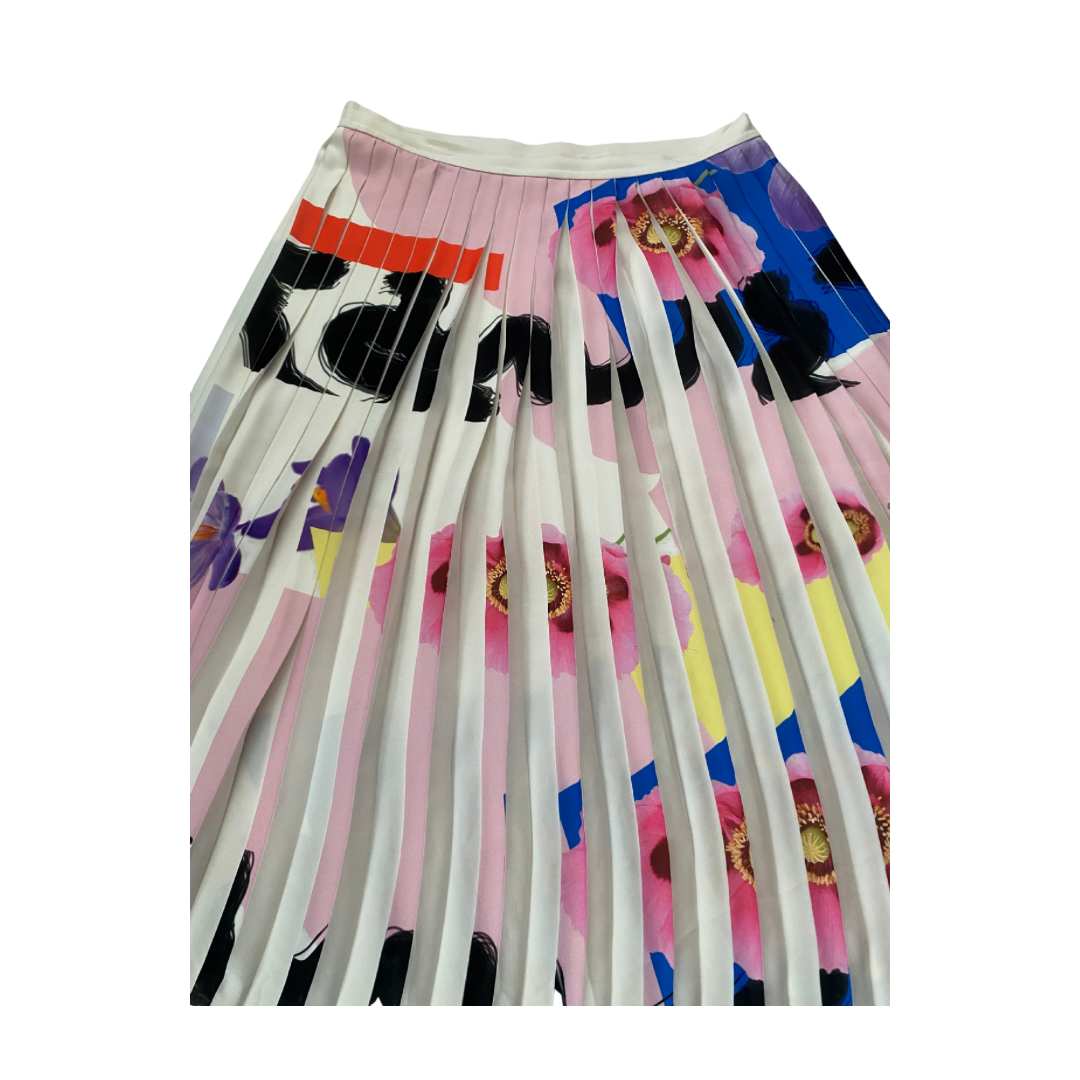 Colorful pleated skirt with abstract patterns on a white background