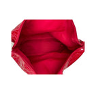 Close-up of a red handbag with a textured surface on a white background