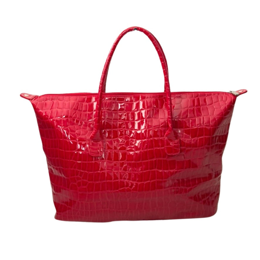 Red crocodile-patterned handbag on a white background