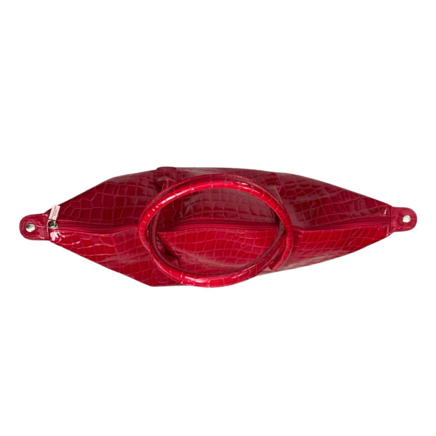 Red crocodile-patterned clutch bag on a white background