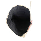 Black bag with beige trim on a white background