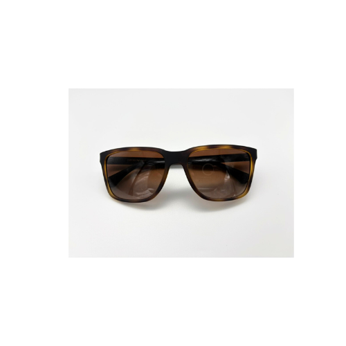 Sunglasses with brown lenses and black frame on a white background