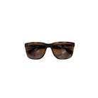 Sunglasses with tortoiseshell frame and brown lenses on a white background
