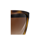 Close-up of a tortoiseshell sunglasses frame with brown gradient lens on a white background