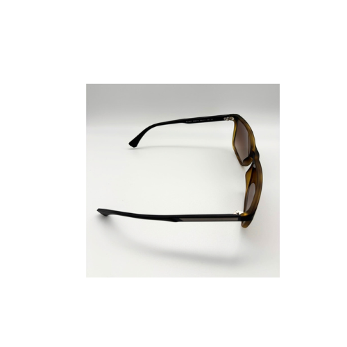 Sunglasses with tortoiseshell frame and dark lenses on a white background