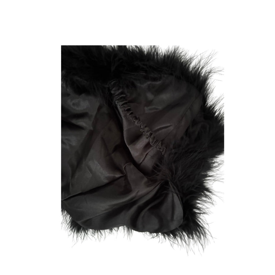 Black fur cape on a white background