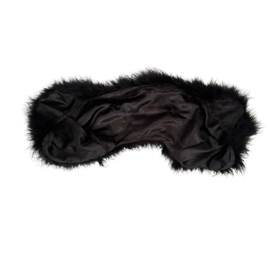 Black satin cape with fur trim on a white background