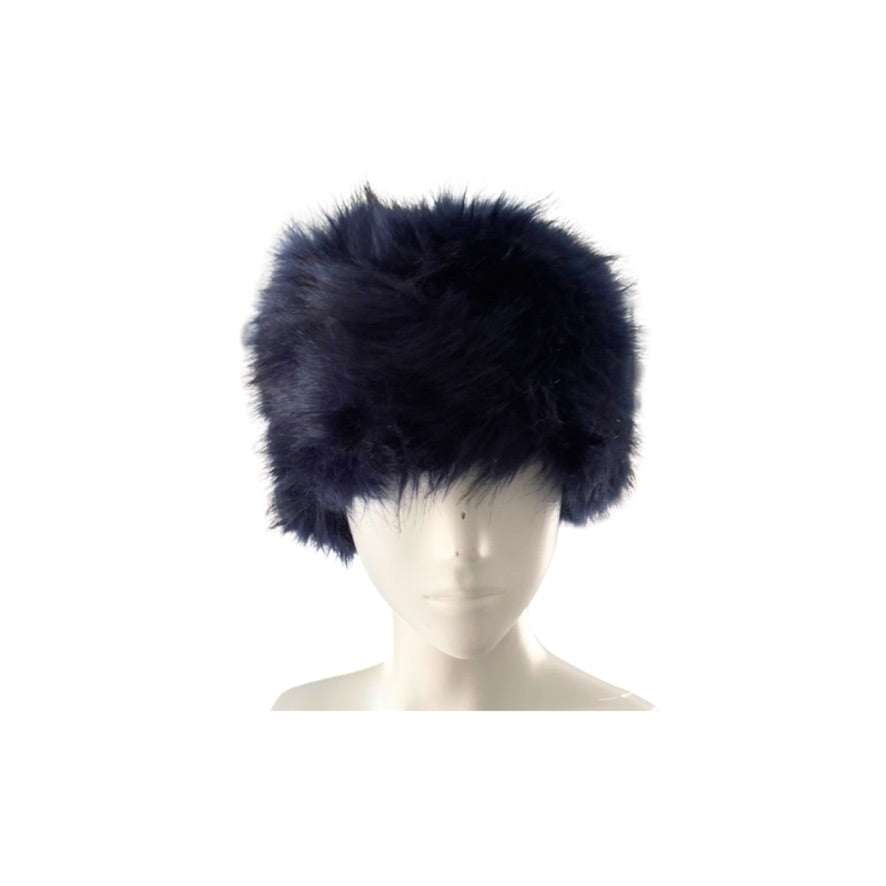 Navy blue fur hat on a mannequin head against a white background