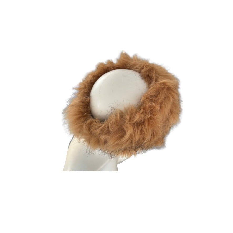 Brown fur headband on a mannequin head against a white background