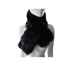 Black fur scarf on a mannequin against a white background